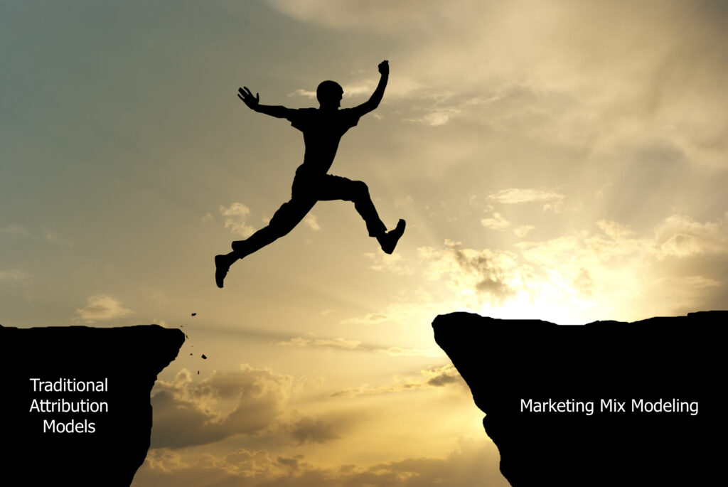 person jumping from ledge that says "traditional attribution models" to ledge that says "marketing mix modeling"